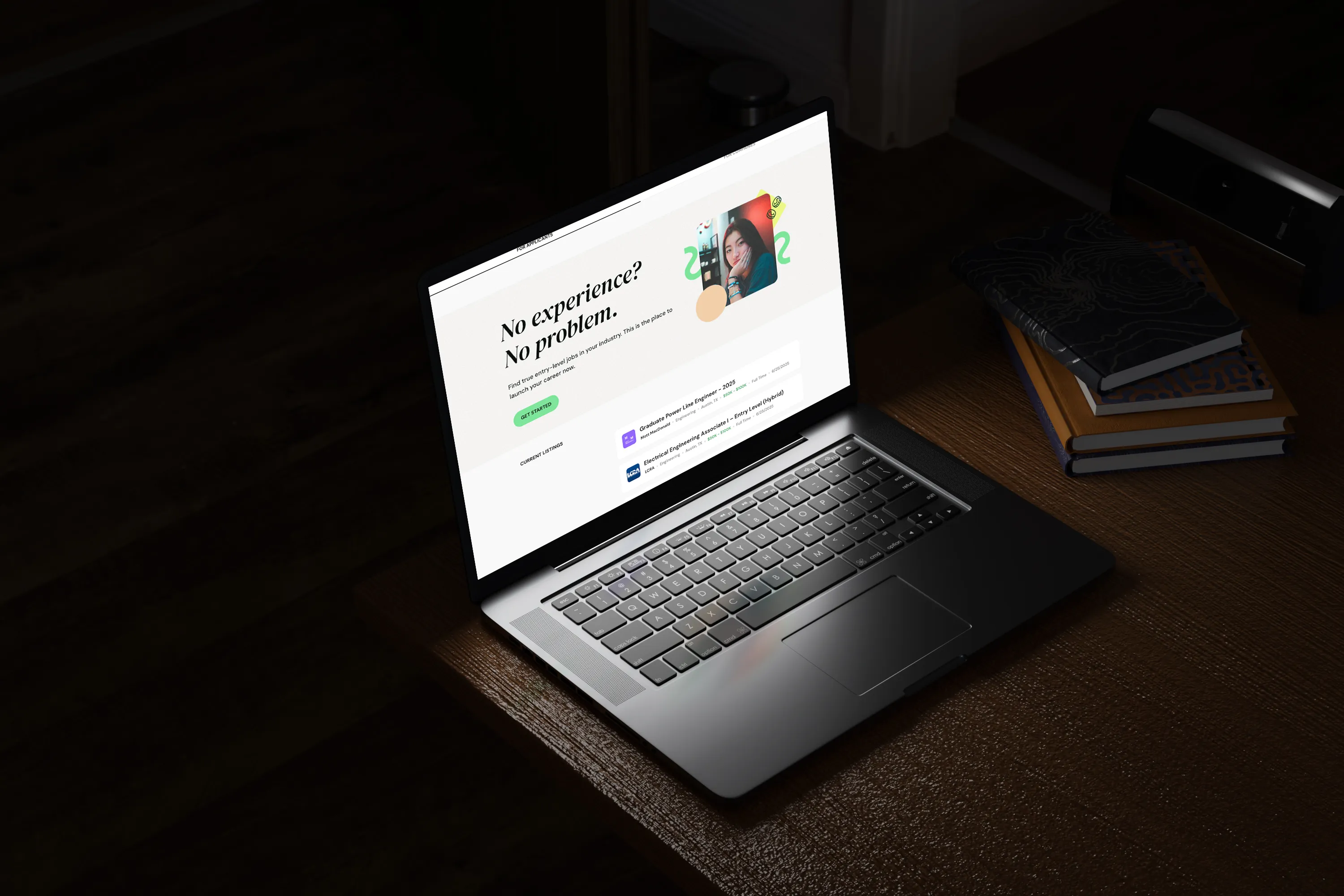 A laptop show the homepage for NoExperienceJobs.io sits on a wooden table in a living room